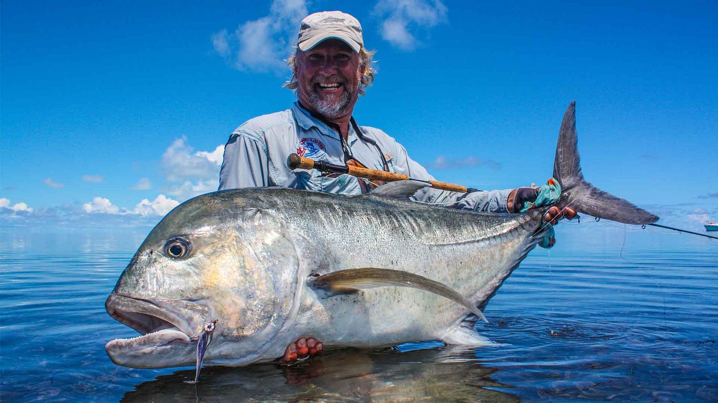 Angler with Large Giant Trevally