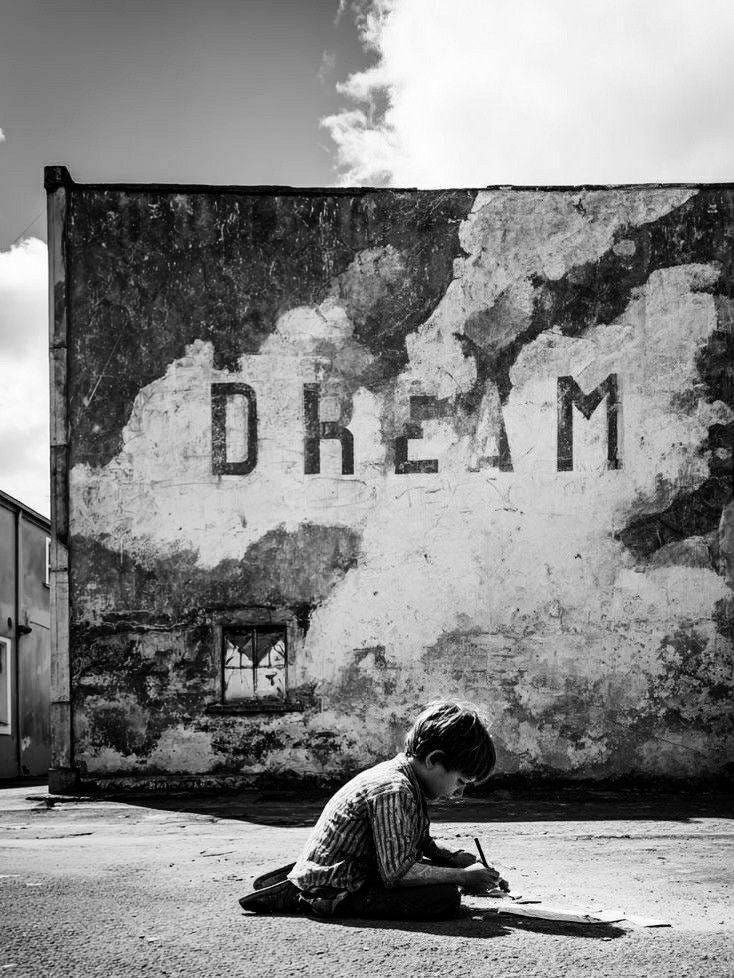 May be a black-and-white image of child and text that says 'DRE D REAM DREAM AM M' May be a black-and-white image of child and text that says 'DRE D REAM DREAM AM M'