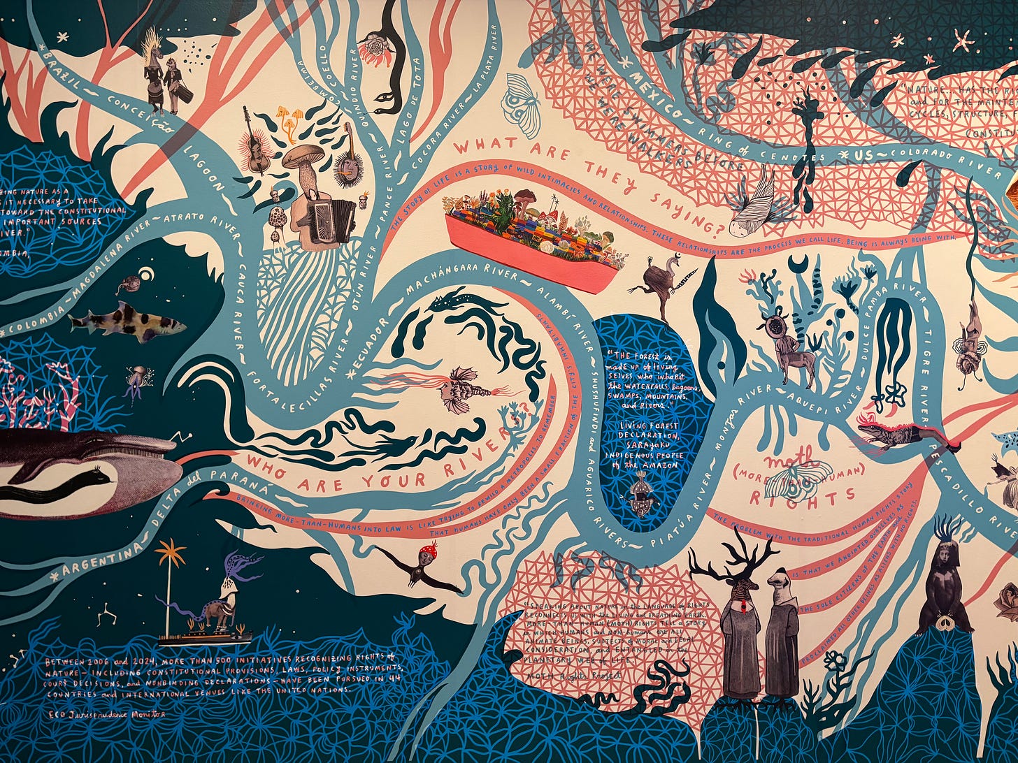 Photo of a mural showing a map of rivers with images and text Photo of a mural showing a map of rivers with images and text