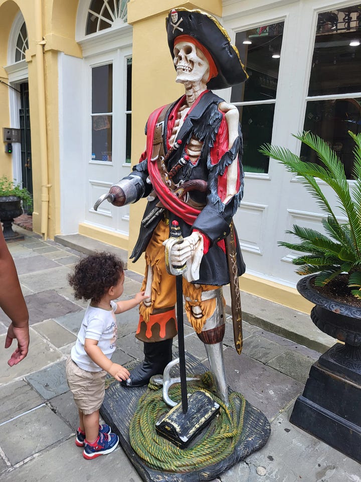 My little bun, Tito, playing with assorted skeletons throughout New Orleans