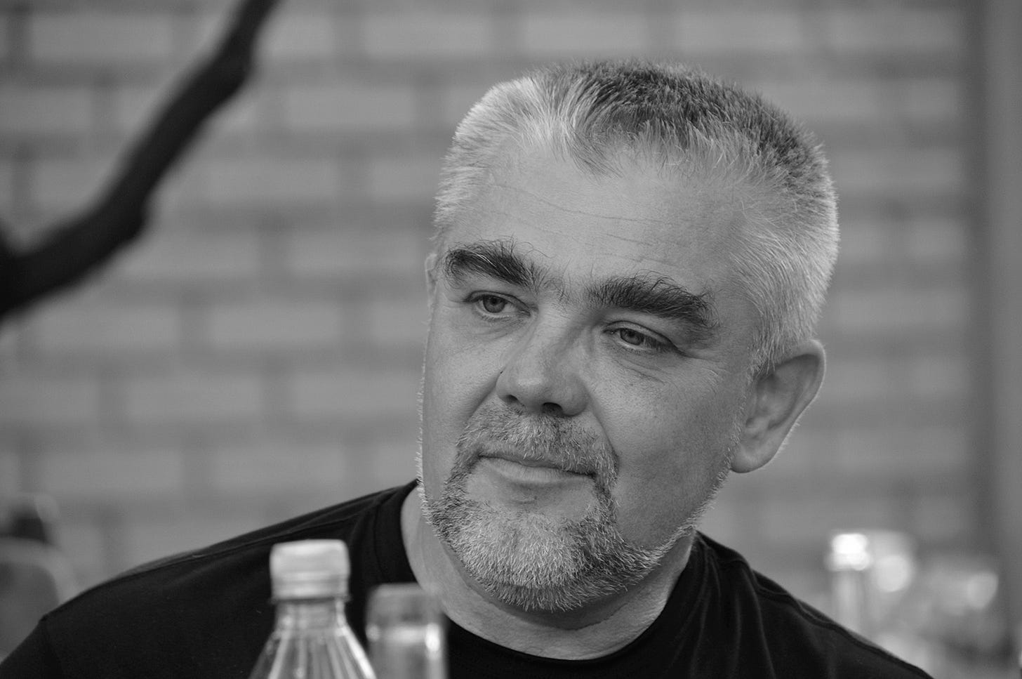 May be a black-and-white image of one or more people and beard