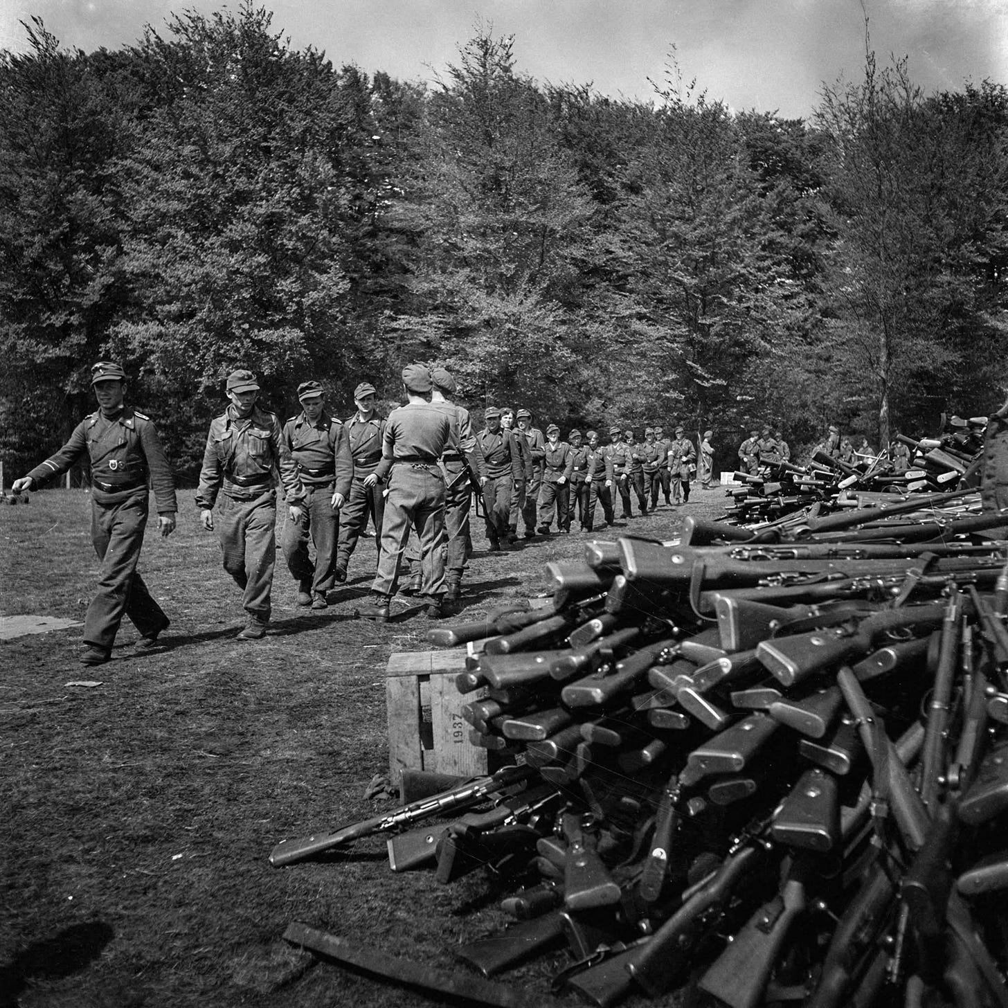 German soldiers surrender their weapons in Soest, May 10, 1945, marking the end of WWII in Europe.