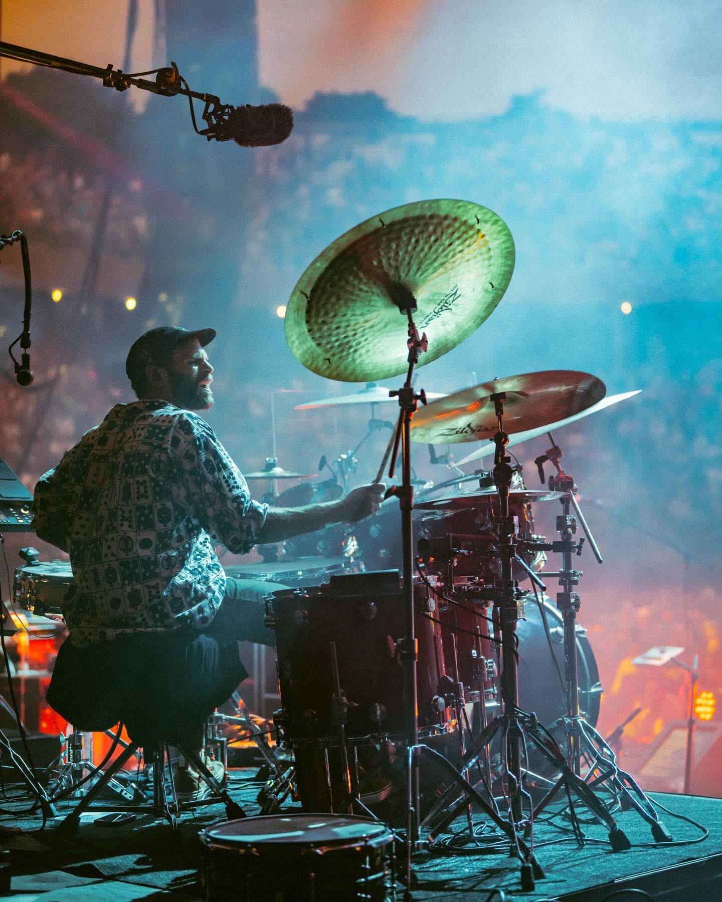 May be an image of 1 person and cymbal