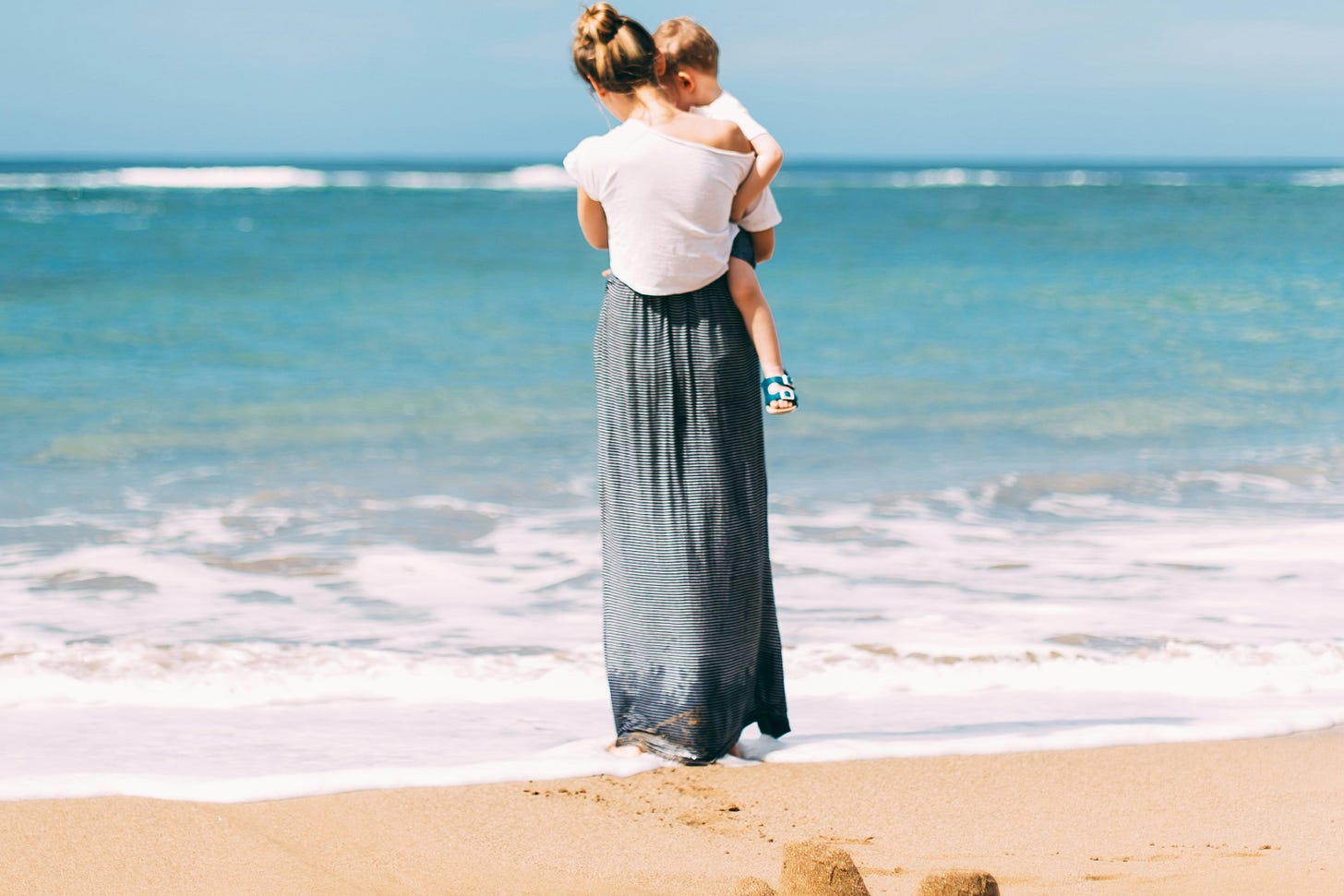 woman and child at beach