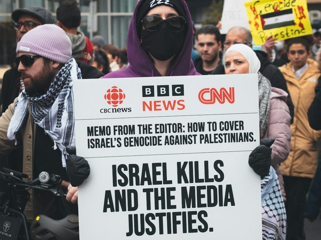 a man holding a sign in a crowd of people