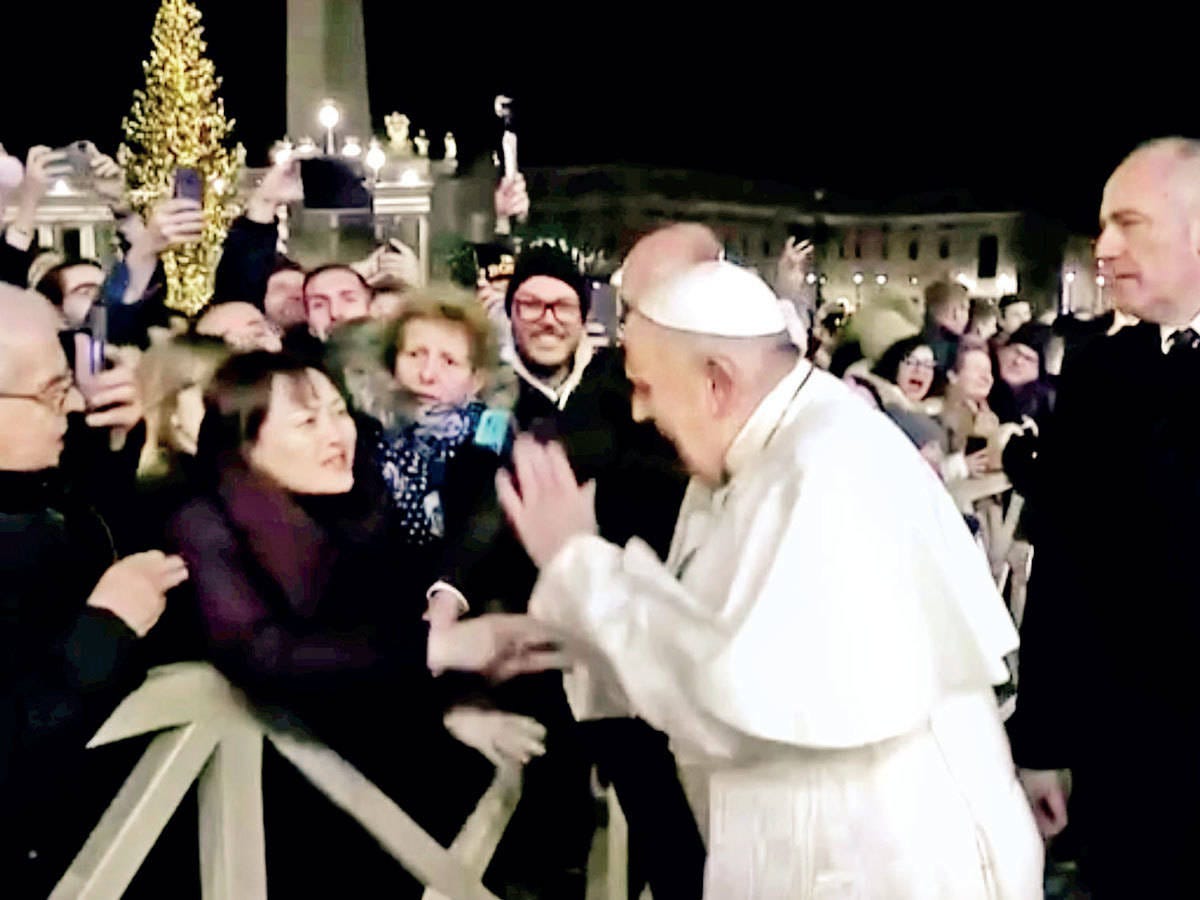 Pope apologises for slapping arm of pilgrim who tugged him Pope apologises for slapping arm of pilgrim who tugged him