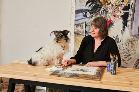 Photos of Jo Scott and her dog Thomasina with her dog art in her studio from 2018