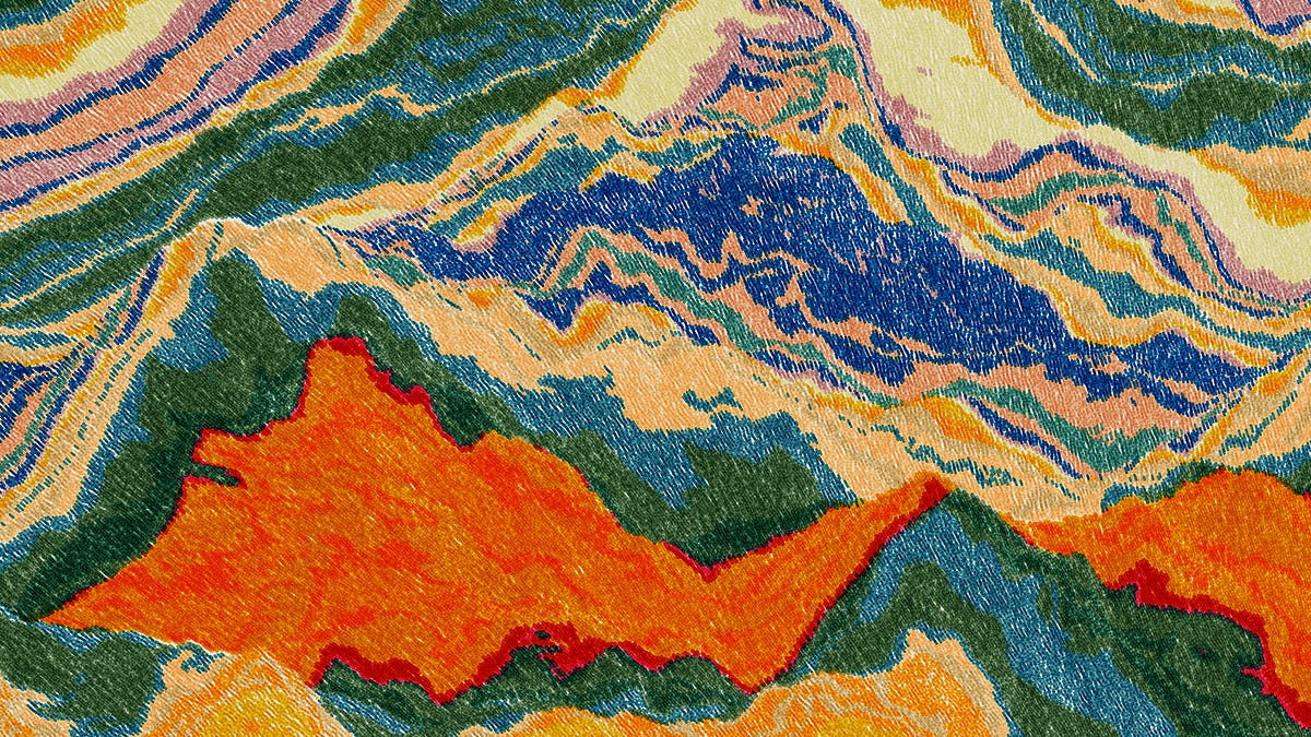 Close detail of a Meridian: orange peaks against blue, green and cream strata