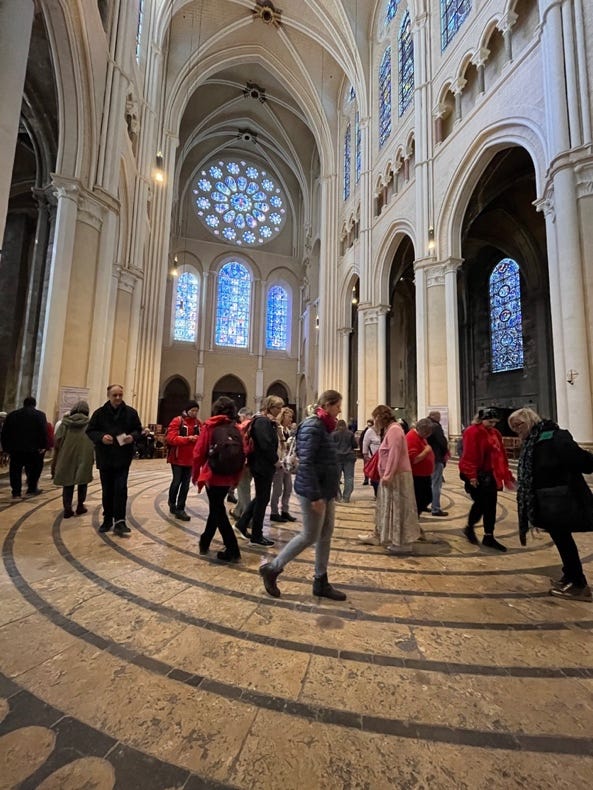 A group of people in a large building

Description automatically generated