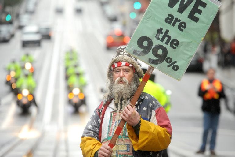 An Occupy protester, who declined to give his name, pickets outside a Bank of America branch on Friday, Jan. 20, 2012, in San Francisco. Anti-Wall Street demonstrators across the U.S. planned rallies Friday in front of banks and courthouses. (AP Photo/Noah Berger) An Occupy protester, who declined to give his name, pickets outside a Bank of America branch on Friday, Jan. 20, 2012, in San Francisco. Anti-Wall Street demonstrators across the U.S. planned rallies Friday in front of banks and courthouses. (AP Photo/Noah Berger)