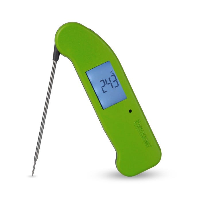 A green thermometer with a long needle

Description automatically generated