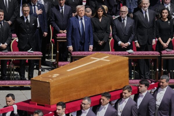 The coffin of Pope Francis is carried in front of dignitaries, including President Donald Trump, center, during his funeral in St. Peter's Square at the Vatican, Saturday, April 26, 2025. (AP Photo/Gregorio Borgia) The coffin of Pope Francis is carried in front of dignitaries, including President Donald Trump, center, during his funeral in St. Peter's Square at the Vatican, Saturday, April 26, 2025. (AP Photo/Gregorio Borgia)