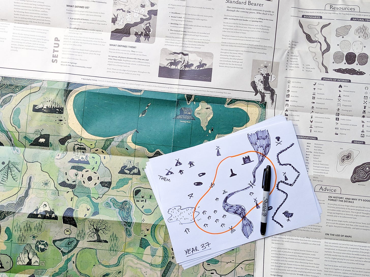 Photo. A stack of hand drawn maps filled with simple markings for houses, areas of land, animals, and castles.