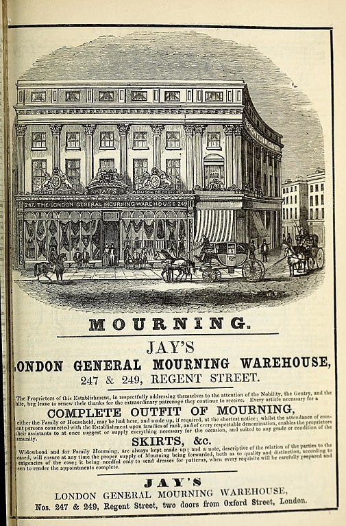 A vintage newspaper advert with an engraving of an elaborate storefront.