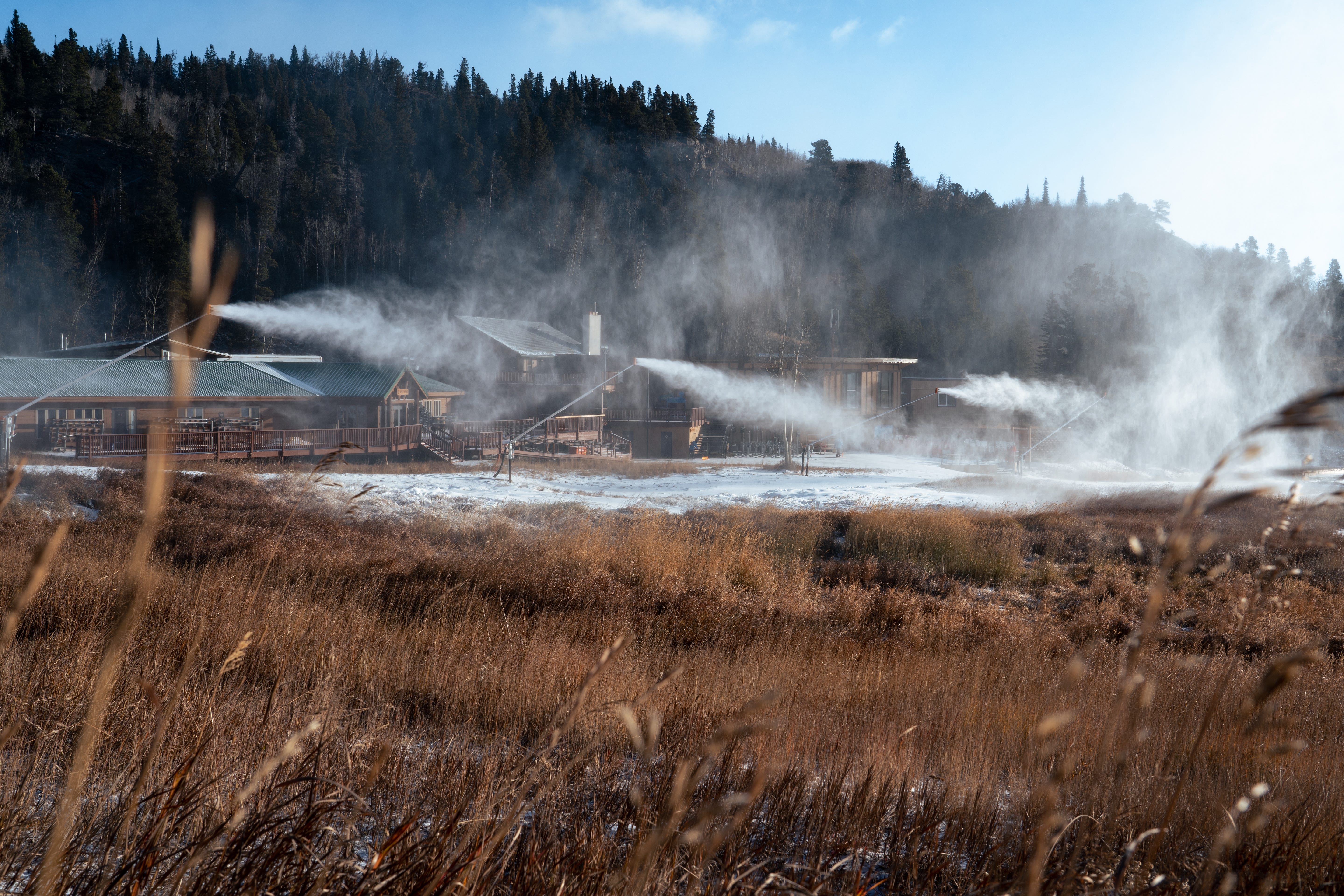 snow guns blanketing the ground near Eldora's base lodge