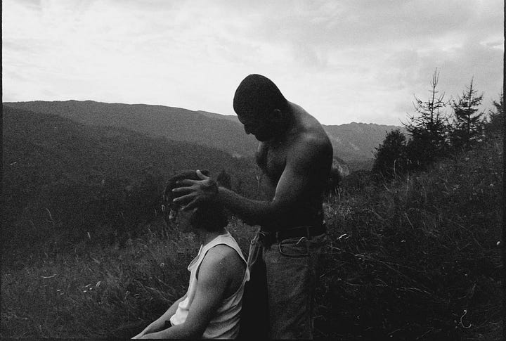 Asa Tata Asa Fiu album cover and a low lit Kit Gordon.