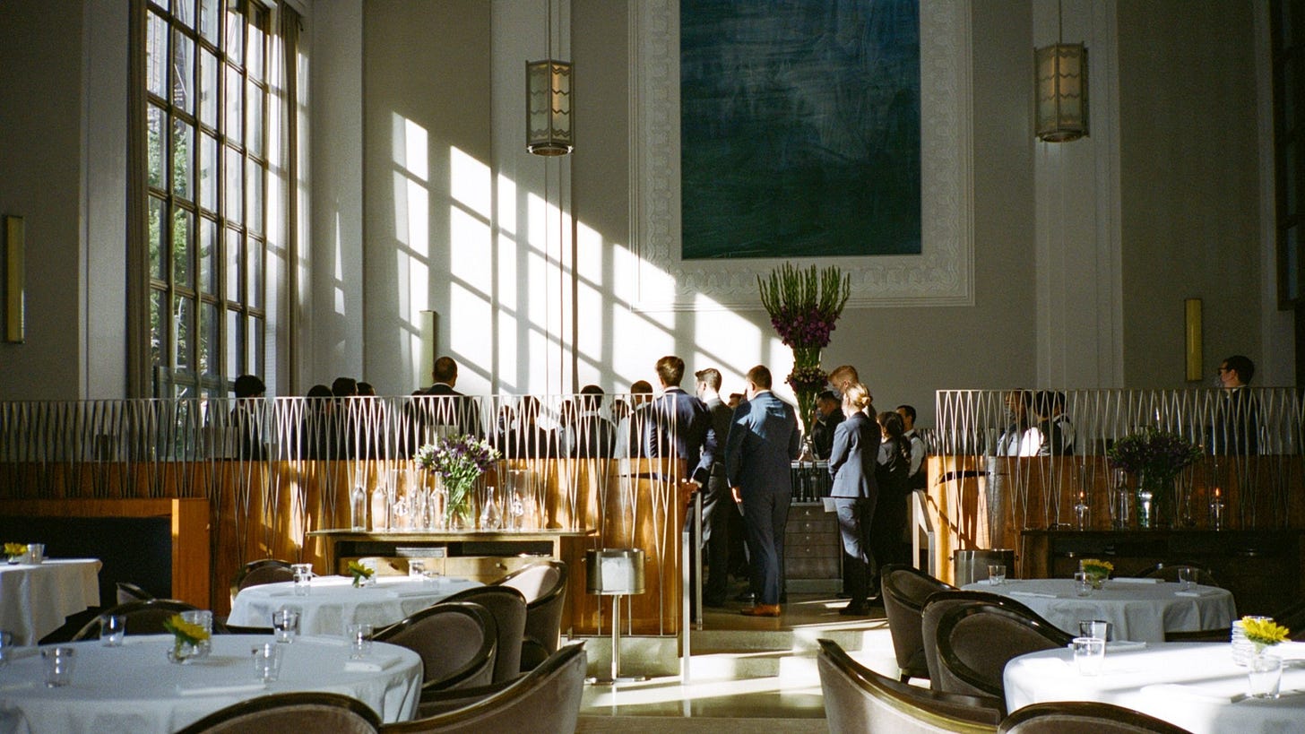 The dining room team meeting before opening for service. The dining room team meeting before opening for service.