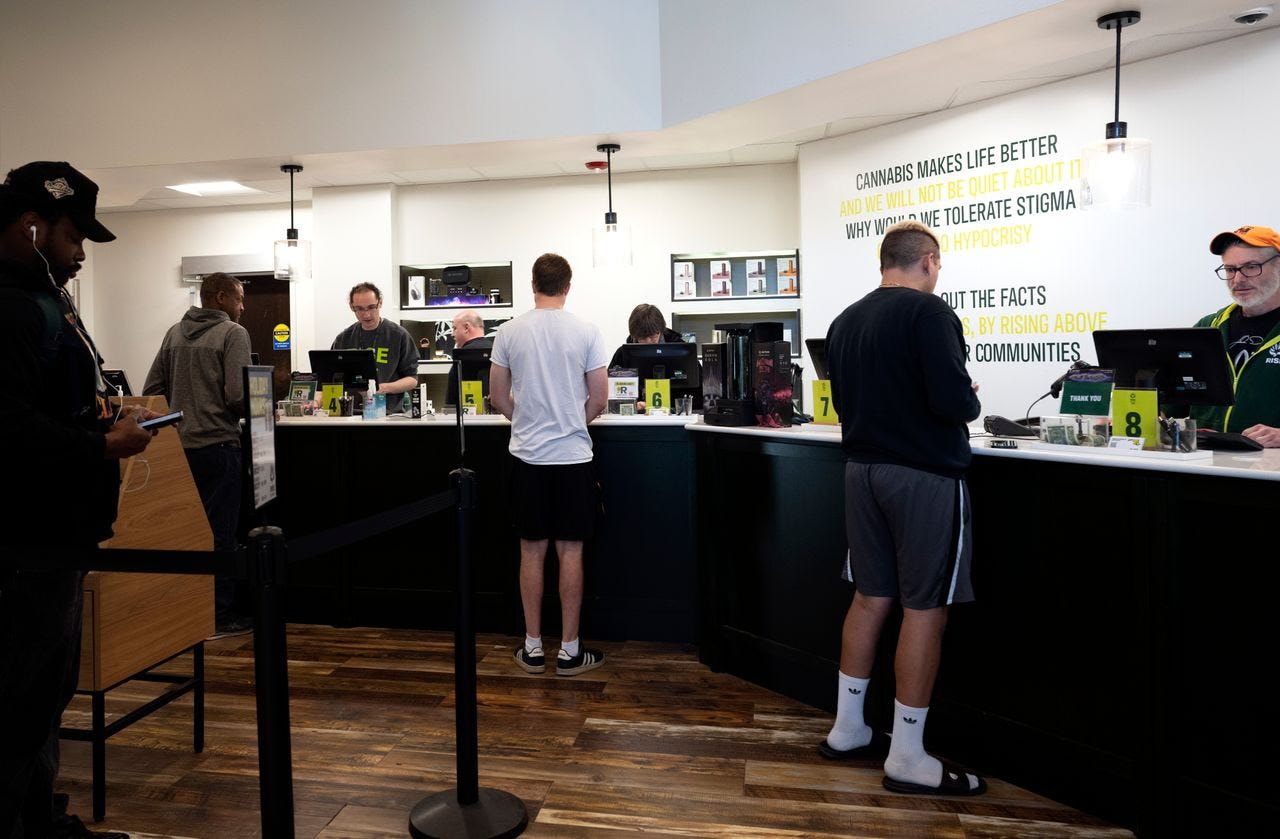 Customers line up to take advantage of sales yesterday at RISE marijuana dispensary in Silver Spring, Maryland. (Marvin Joseph/The Washington Post)