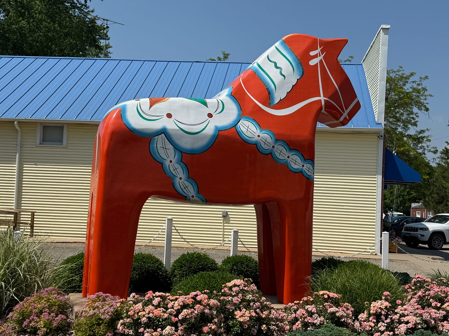 Giant red wooden horse outside of the history center in Swedensburg, MO. It's as tall as the building! Giant red wooden horse outside of the history center in Swedensburg, MO. It's as tall as the building!
