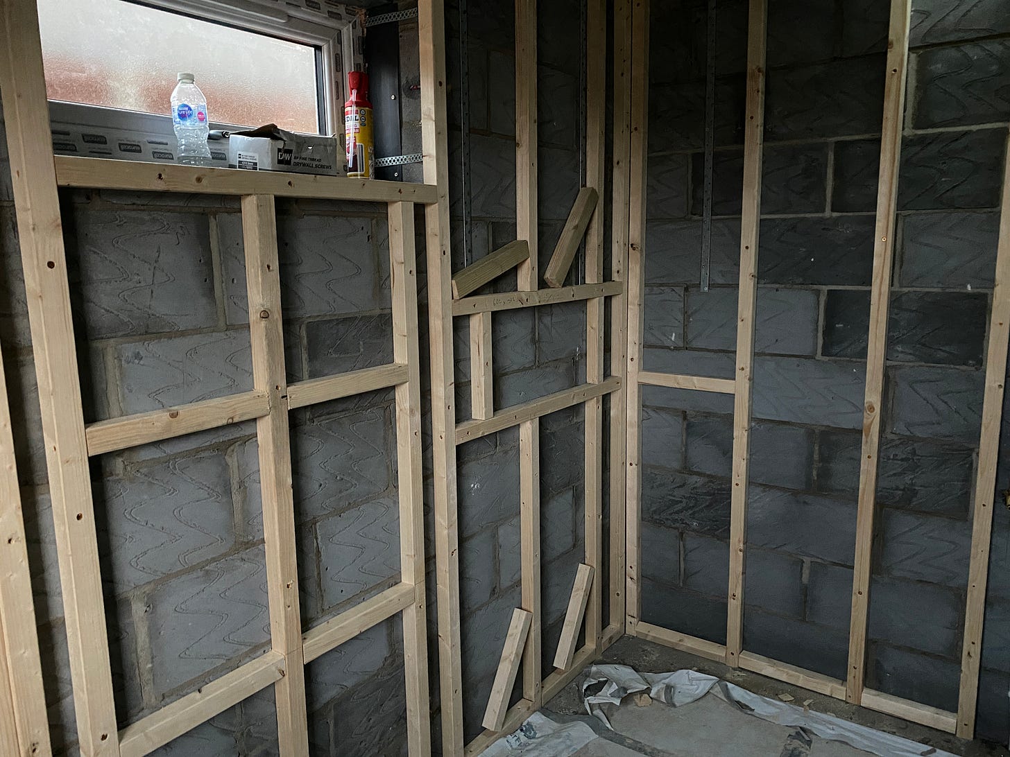 wooden battens added to the brick walls for stud work wooden battens added to the brick walls for stud work