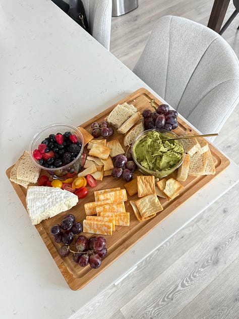 A photo gallery featuring moments from daily life and wellness: a charcuterie board, a cozy dog lounging on a bed, snowy mountain scenes, skiing, smiling couple, a local Boulder shop sign, spring flowers, a knit project, and a scenic desert hike.” This keeps it keyword-relevant (wellness, nature, lifestyle, Boulder, cozy, daily moments) and descriptive enough for accessibility.