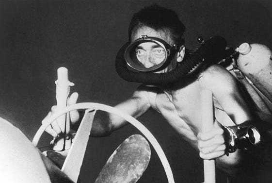 Captain Jacques-Yves Cousteau, pioneering SCUBA gear in the Mediterranean Sea, 1955, while filming his iconic 1956 documentary, 'The Silent World.'