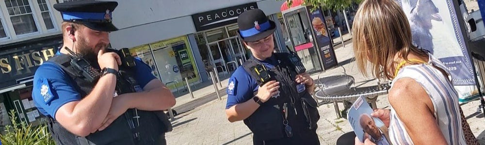 Police Community Support Officers with volunteer on Dog Watch stand