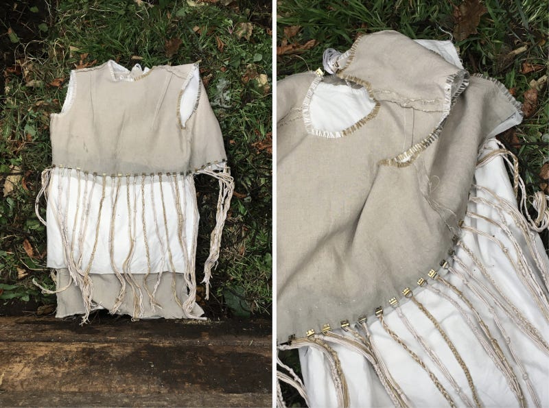 View of the linen-cotton dress on top of vegetable scraps and green waste in the compost bay of an aerobic composting system. View of the linen-cotton dress on top of vegetable scraps and green waste in the compost bay of an aerobic composting system.