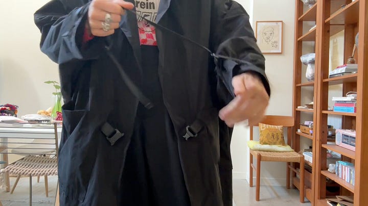 Black oversized nylon jacket with industrial hardware