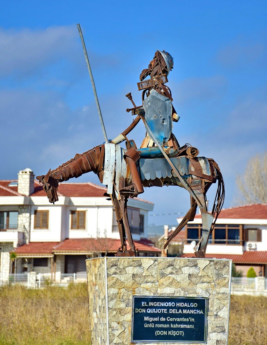 a statue of a man on a horse with a sword