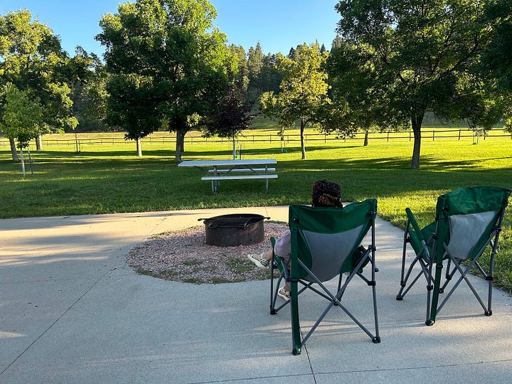 The left image shows a gray tent deep in the woods of the Smokey Mountains, with trekking poles leaning against a tree in the background. The right image shows Nicole sitting in a camp chair in the daytime, on a concrete camp pad at Custer State Park in South Dakota.