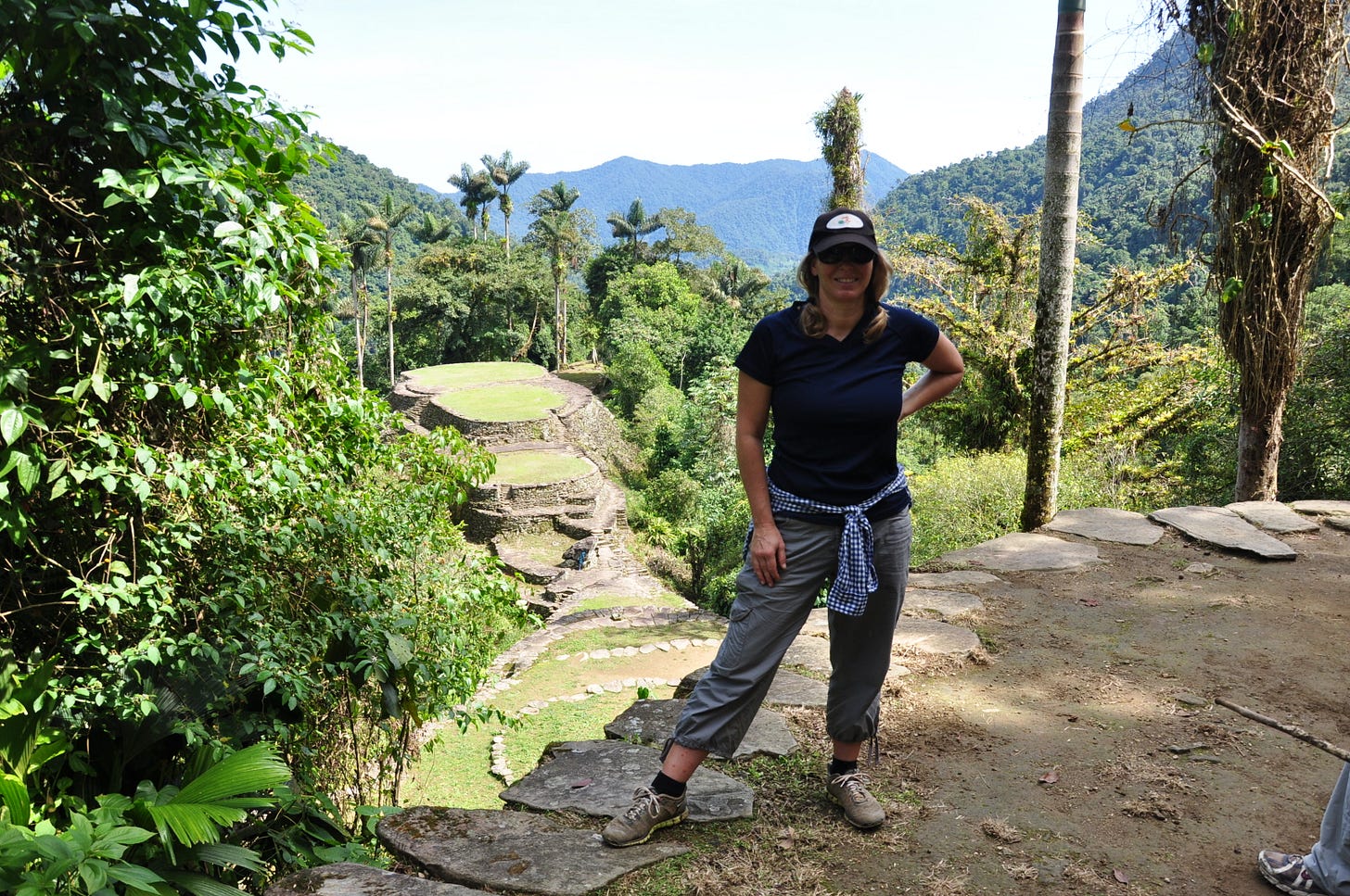 Erin Michelson in front of terraces in Colombia Santa Marta mountain trek to Ciudad Perdida lost city.