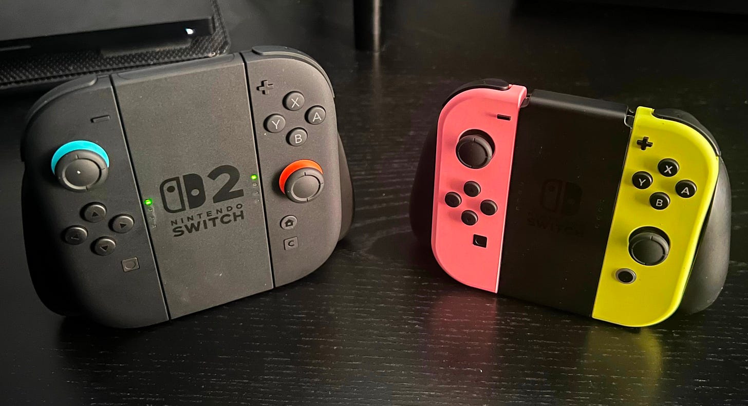 Joy-Con 2s next to Joy-Con 1s. The Joy-Con 2s are noticeably bigger.