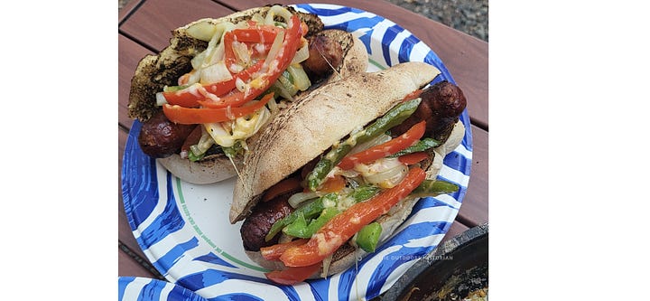 Two photos of hearty camp meals: one showing a pan of sizzling sausages with sautéed peppers and onions, and another showing a plate with a grilled steak, baked potato, and a fresh salad.