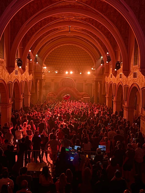a crowd holding up a woman at La Rosa in Tucson