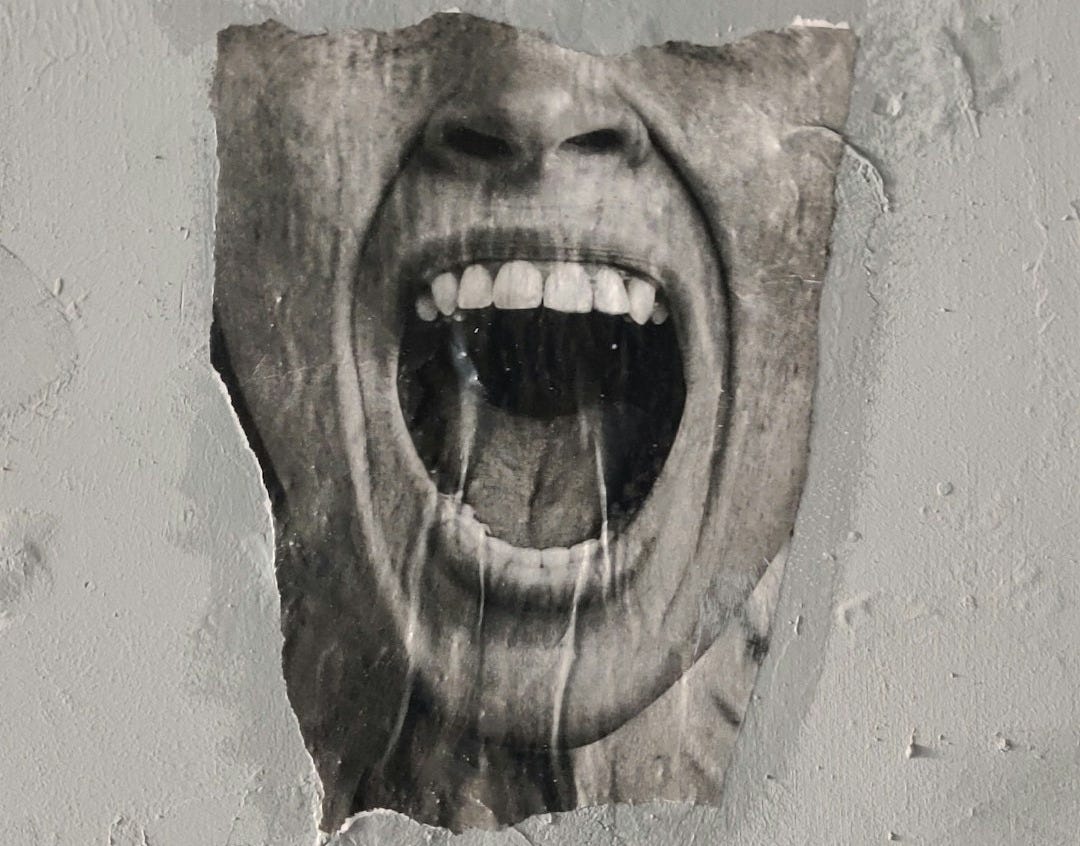 brown wooden human face carved wall