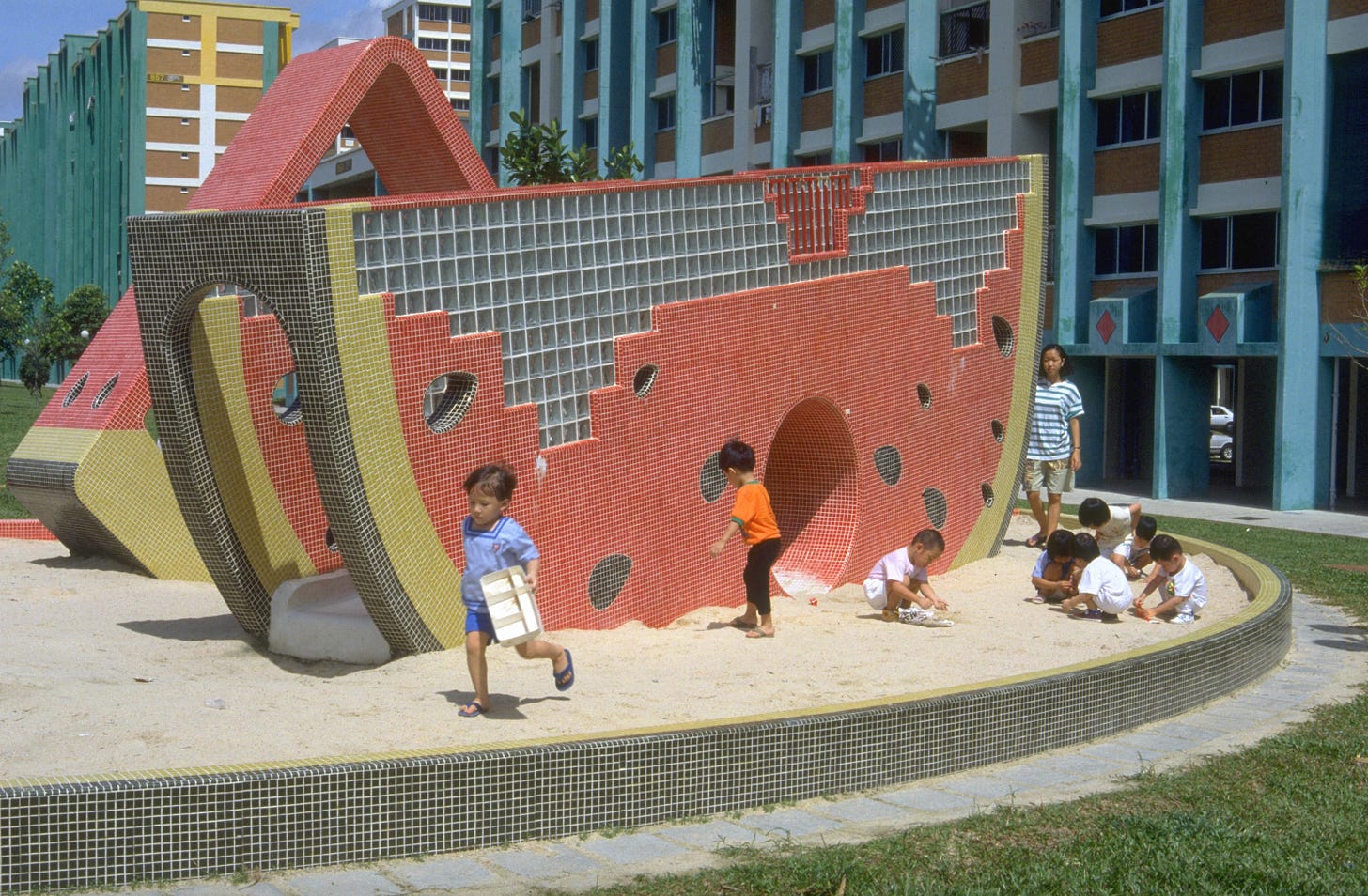 Children play next to a giant watermelon at the Tampines housing estate in 1993. Children play next to a giant watermelon at the Tampines housing estate in 1993.