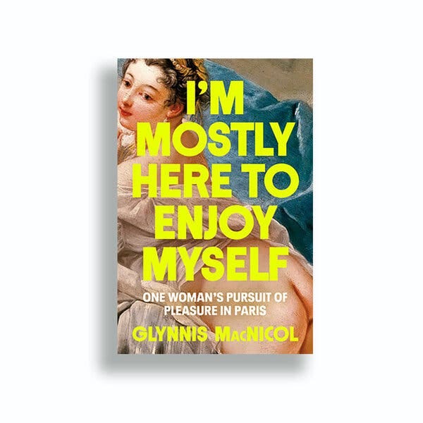 The cover of “I’m Mostly Here to Enjoy Myself” by Glynnis MacNicol features an oil painting of a lounging nude on blue draperies. The text is chartreuse and white. 