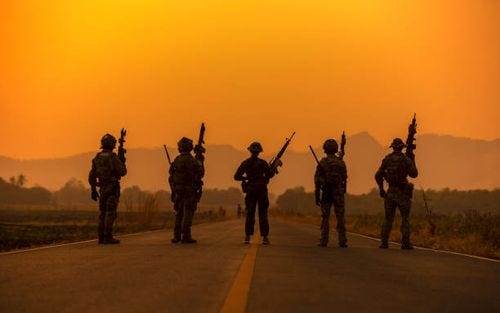 silhouette soldiers on the sunset sky background - special forces stock pictures, royalty-free photos & images