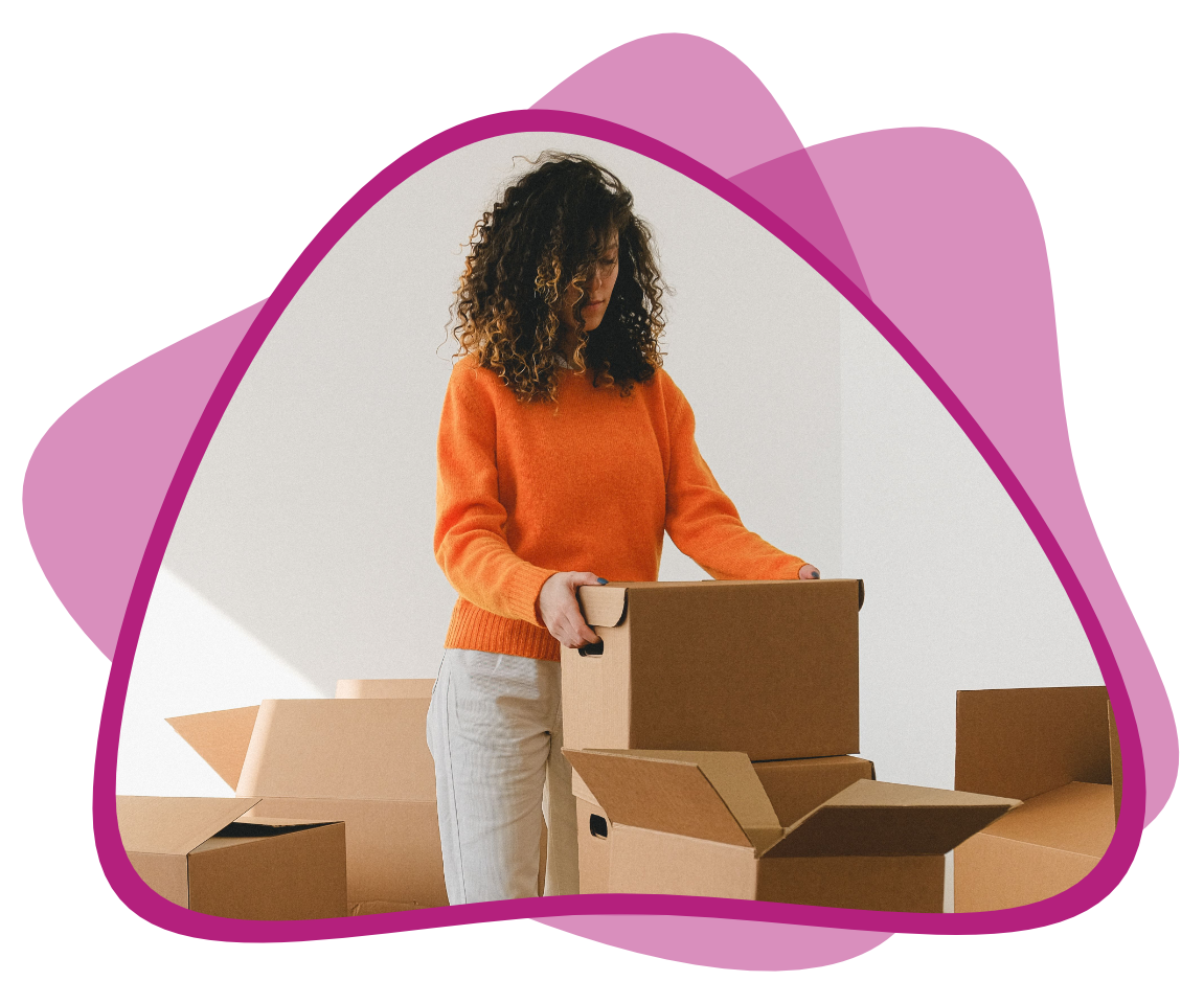 A woman sorts through boxes.