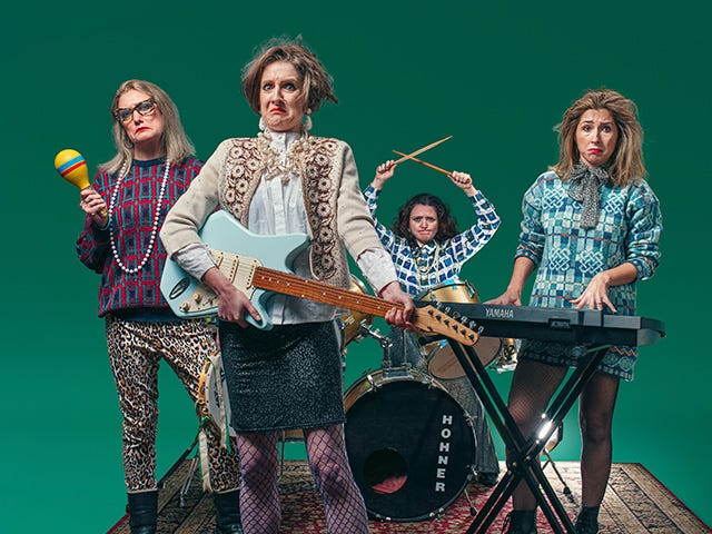 A photograph of the cast of Lynn Faces holding musical instruments