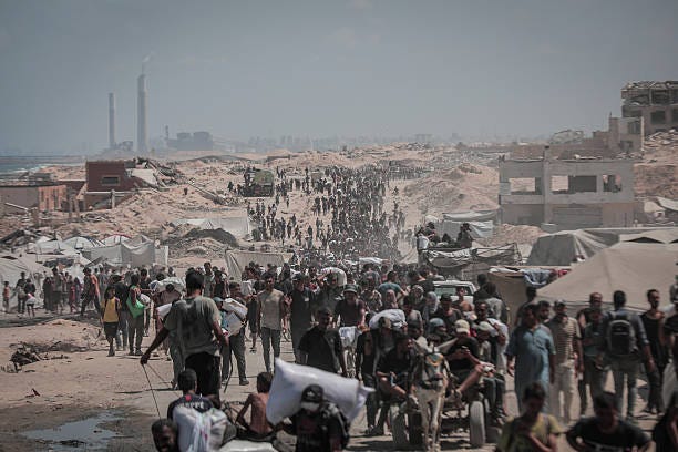 Palestinians flock to the Zikim crossing to acquire limited flour and basic food aid as hunger crisis worsens with the ongoing Israeli blockade in...