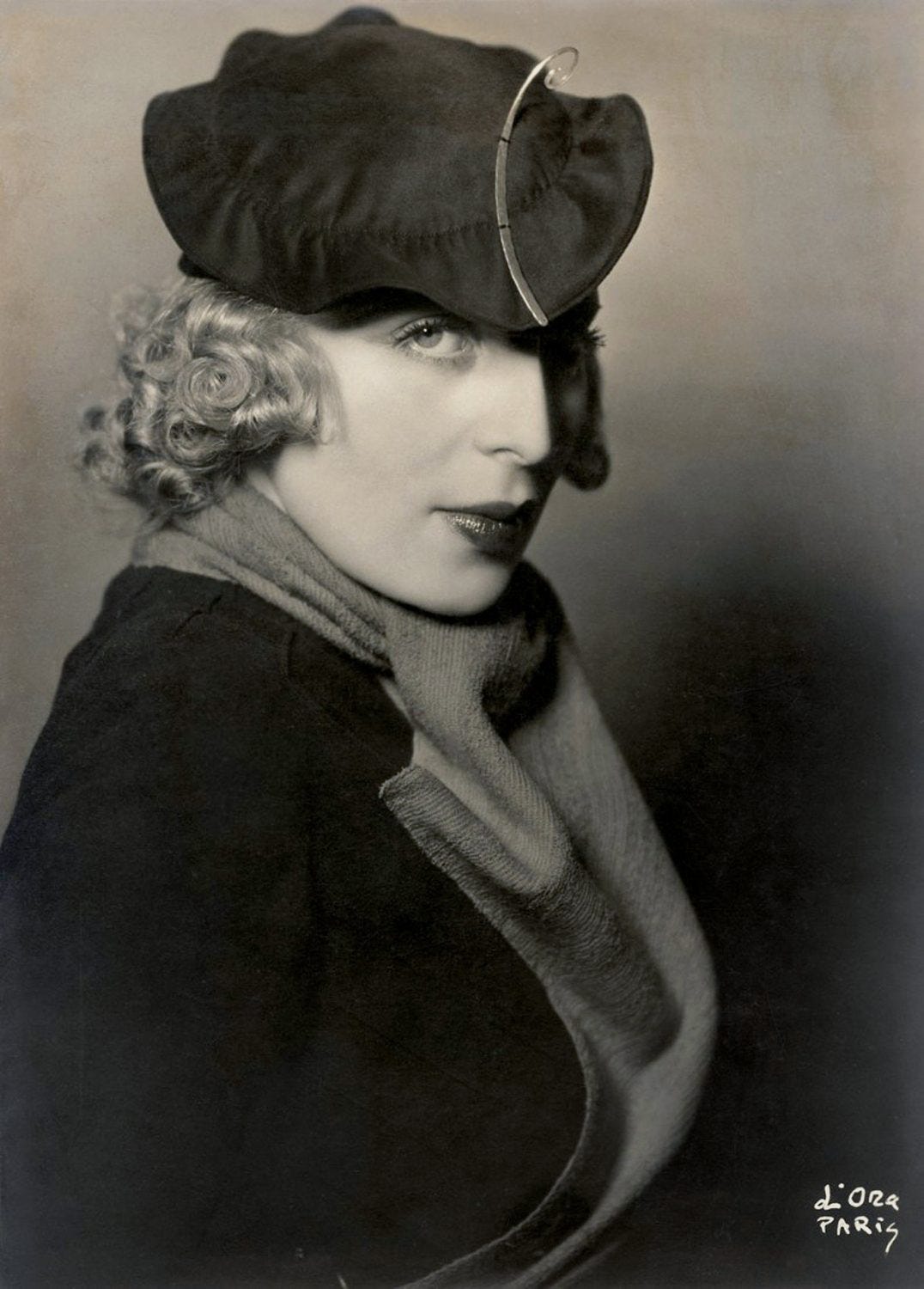 Black and white period photograph portrait of Tamara de Lempicka wearing a hat Black and white period photograph portrait of Tamara de Lempicka wearing a hat