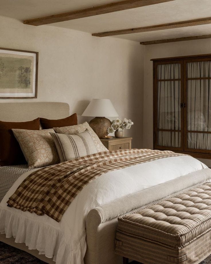 This may contain: a bedroom with a bed, dresser and window