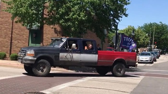 Trumpers are seen in a crappy truck