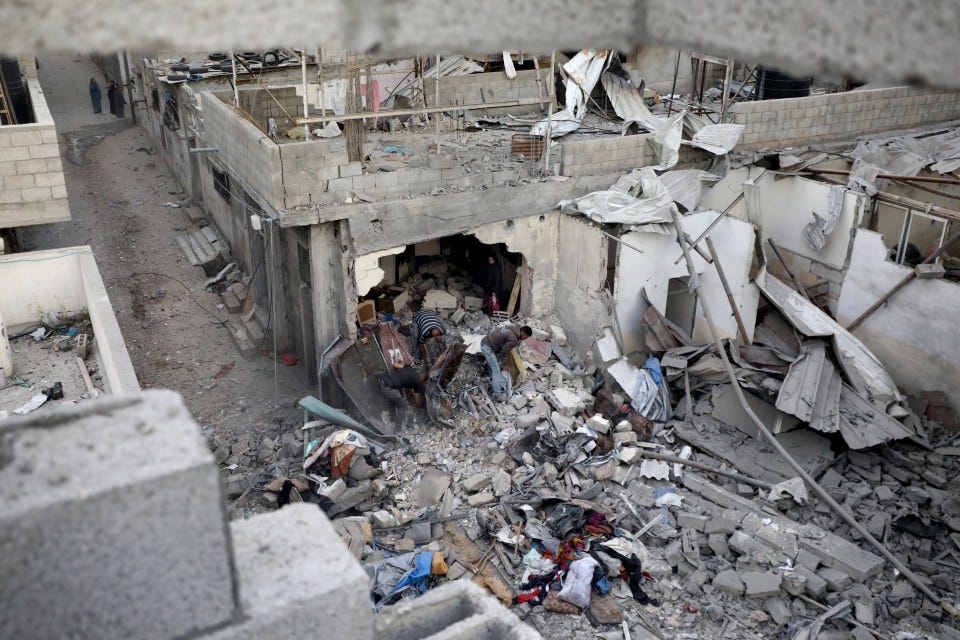 Destruction of Palestinian homes in a refugee camp following an Israeli attack.