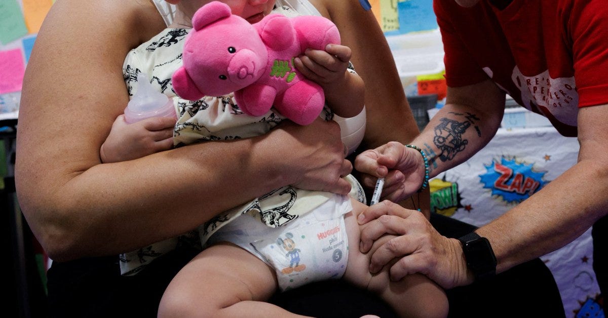 A one-year-old receives a dose of Moderna Spikevax (COVID-19 Vaccine, mRNA) at Skippack Pharmacy in Schwenksville, Pennsylvania, U.S. October 2, 2025. REUTERS/Hannah Beier