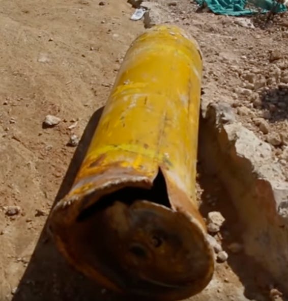 A yellow cylinder on the ground

AI-generated content may be incorrect.