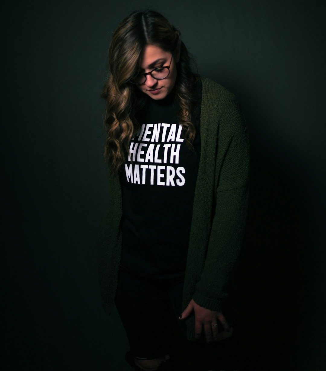 woman in black and white long sleeve shirt woman in black and white long sleeve shirt