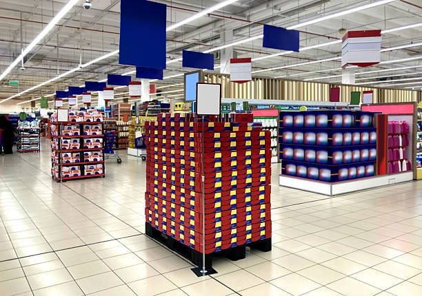 Palette with toothpaste packages in supermarket on promotion Palette with toothpaste packages. Suitable for presenting new packaging design and labels among many others. This Mockup, illustration is useful for Graphic designers and architects. retail display stock pictures, royalty-free photos & images